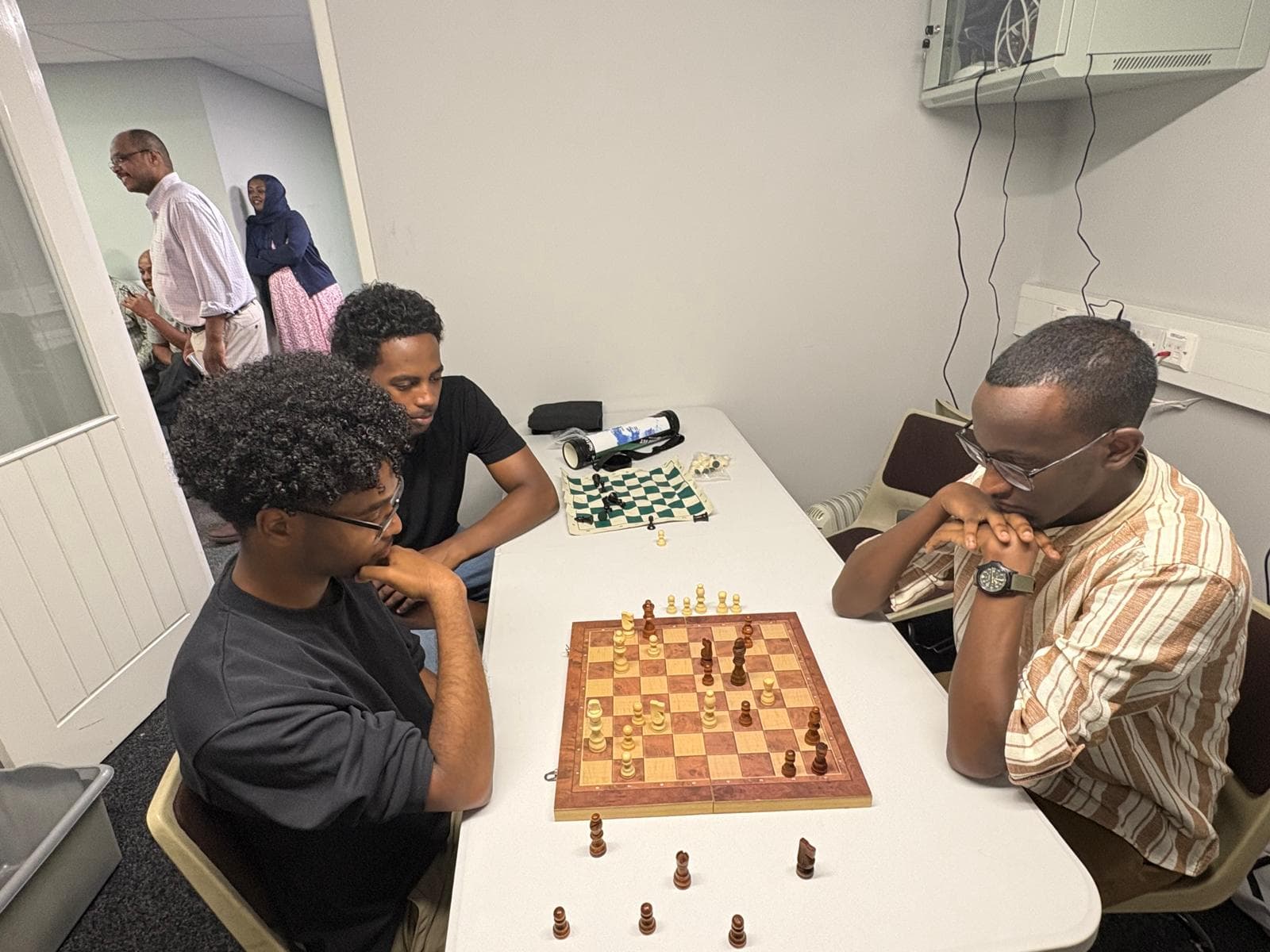 Men playing chess at the centre